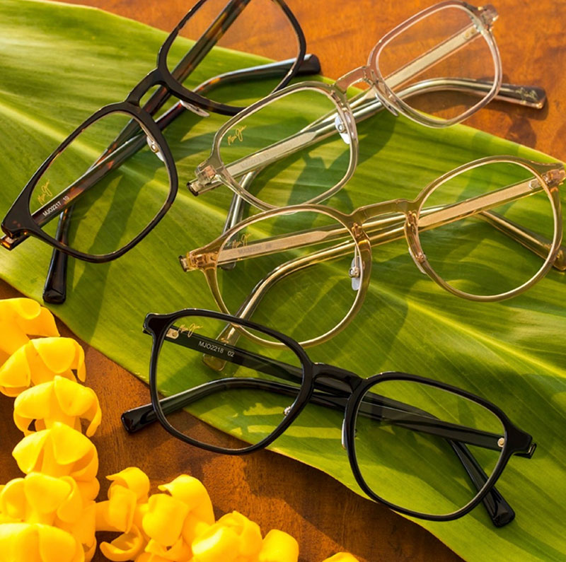 mauijim1 Four pairs of Maui Jim eyeglasses resting on a leaf