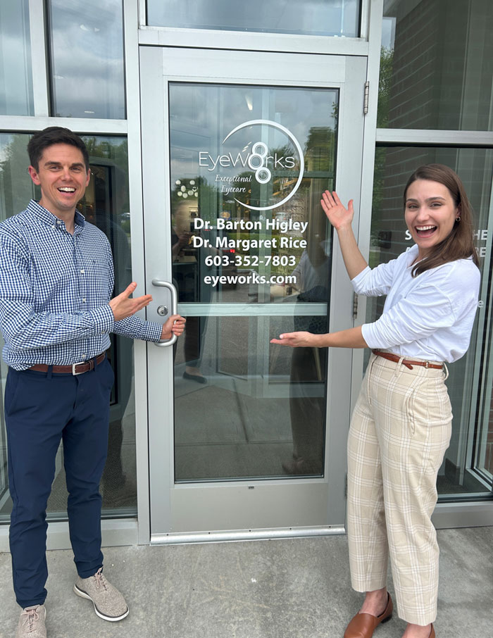 Dr. Higley and Dr. Rice standing in front of the New England Eyeworks front door signage in Keene, NH