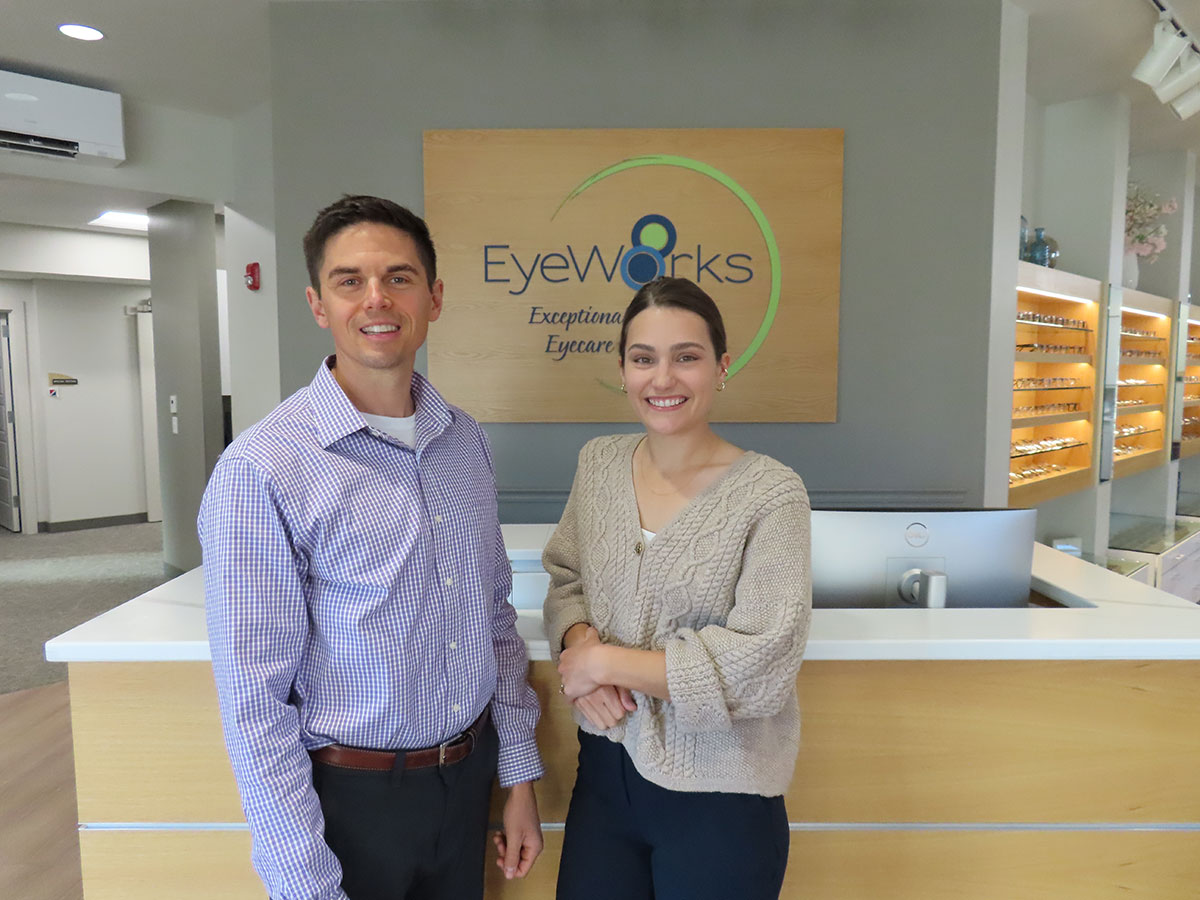 Dr. Higley and Dr. Rice standing in front of the New England Eyeworks front door signage in Keene, NH